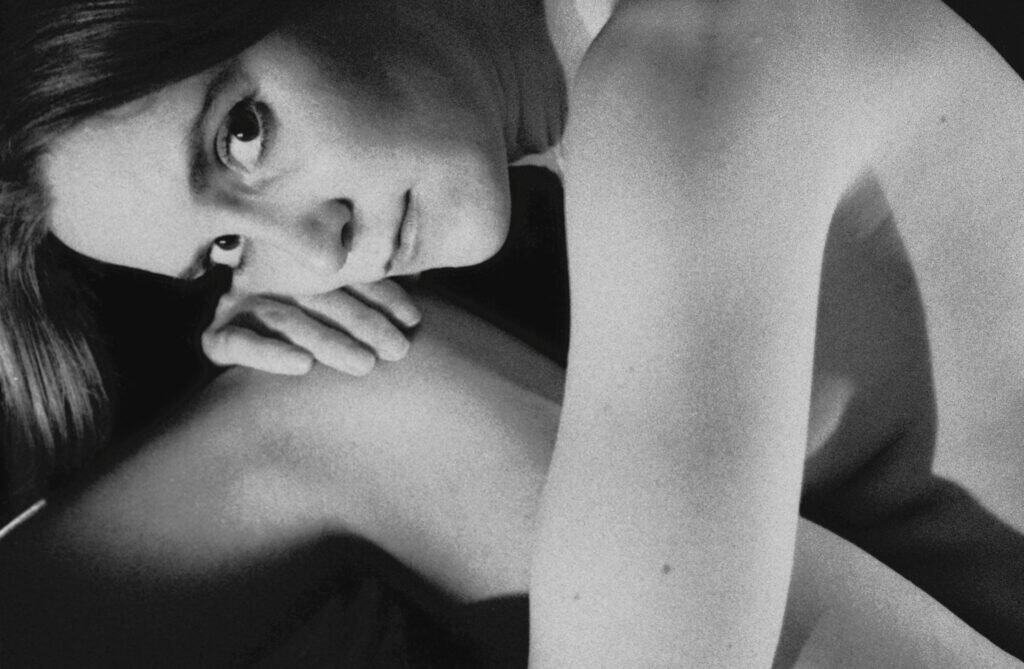 Intimate black and white portrait of a reclining woman